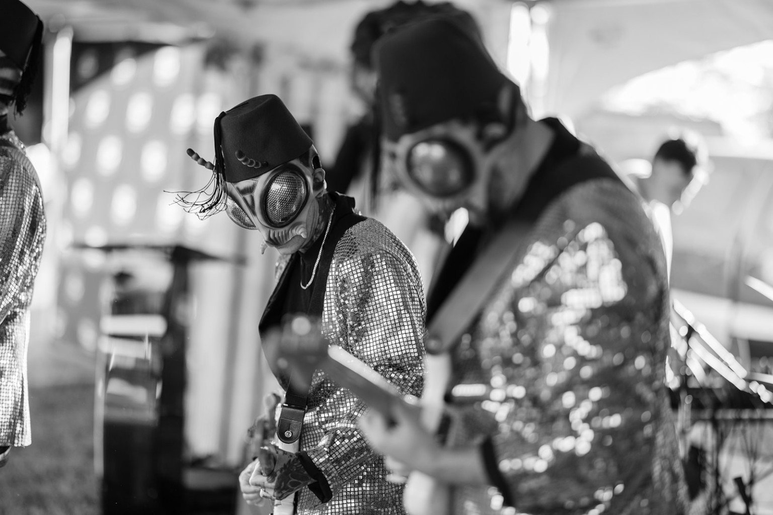 Black and white live performance photo of The Sci-Flies