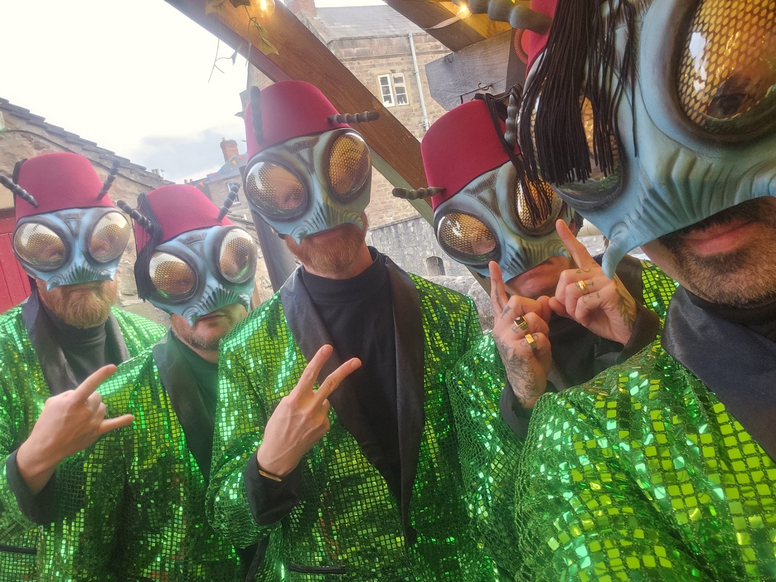 The Sci-Flies in their signature costumes