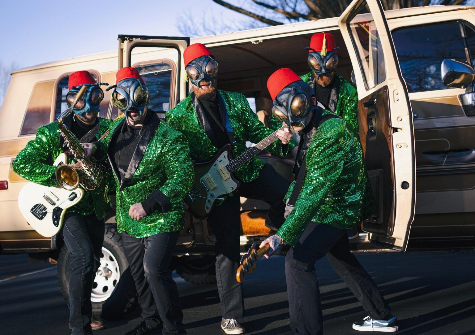 The Sci-Flies outside their van